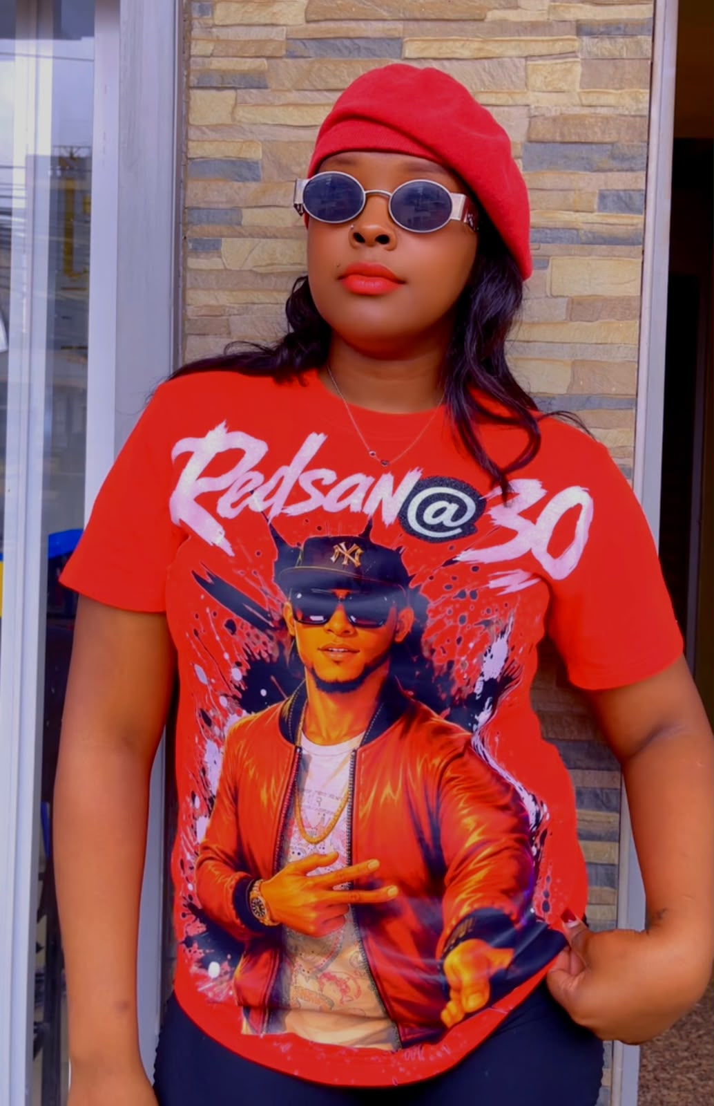 Redsan @30 Tee — Red anniversary tee printed with a painted Redsan portrait and brushed script lettering. Custom Junkies Africa custom tees portfolio piece.