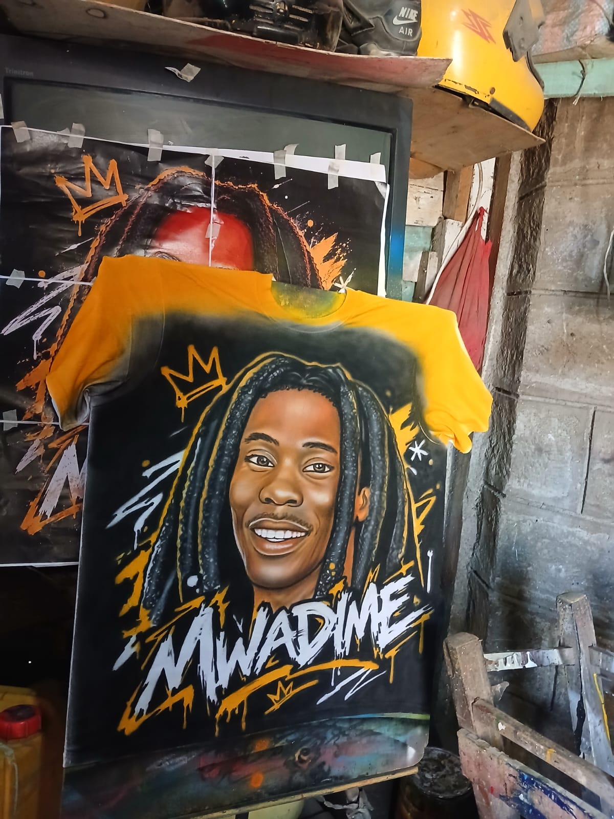 Mwadime — Yellow Fade — Yellow-to-black fade tee with the airbrushed Mwadime portrait and crown graffiti marks. Custom Junkies Africa custom tees portfolio piece.